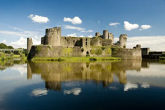 Photo of Caerphilly Castle reflecting in the lake
