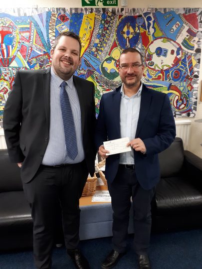 Mark Monteith presents a sponsorship cheque
