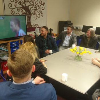 The group watch clips of Morgan Stoddart's rugby achievements
