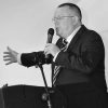 Gary Williams speaks at a conference addressing delegates.
