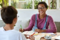 A support worker from New Directions and Hafod provides social care support to a service user.