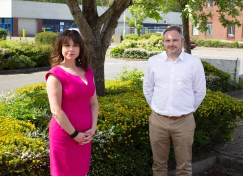 Sophie Cecil and Jon Jones stand together outdoors.